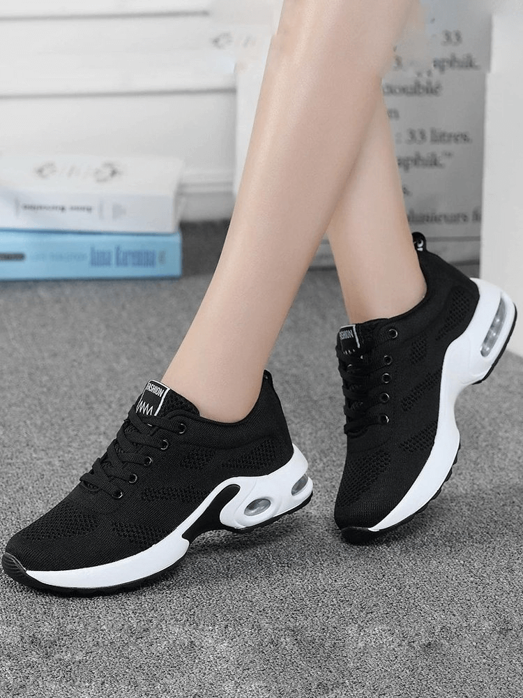 Black breathable women's running shoes with cushioned soles for comfort and flexibility, ideal for natural movement and joint support.